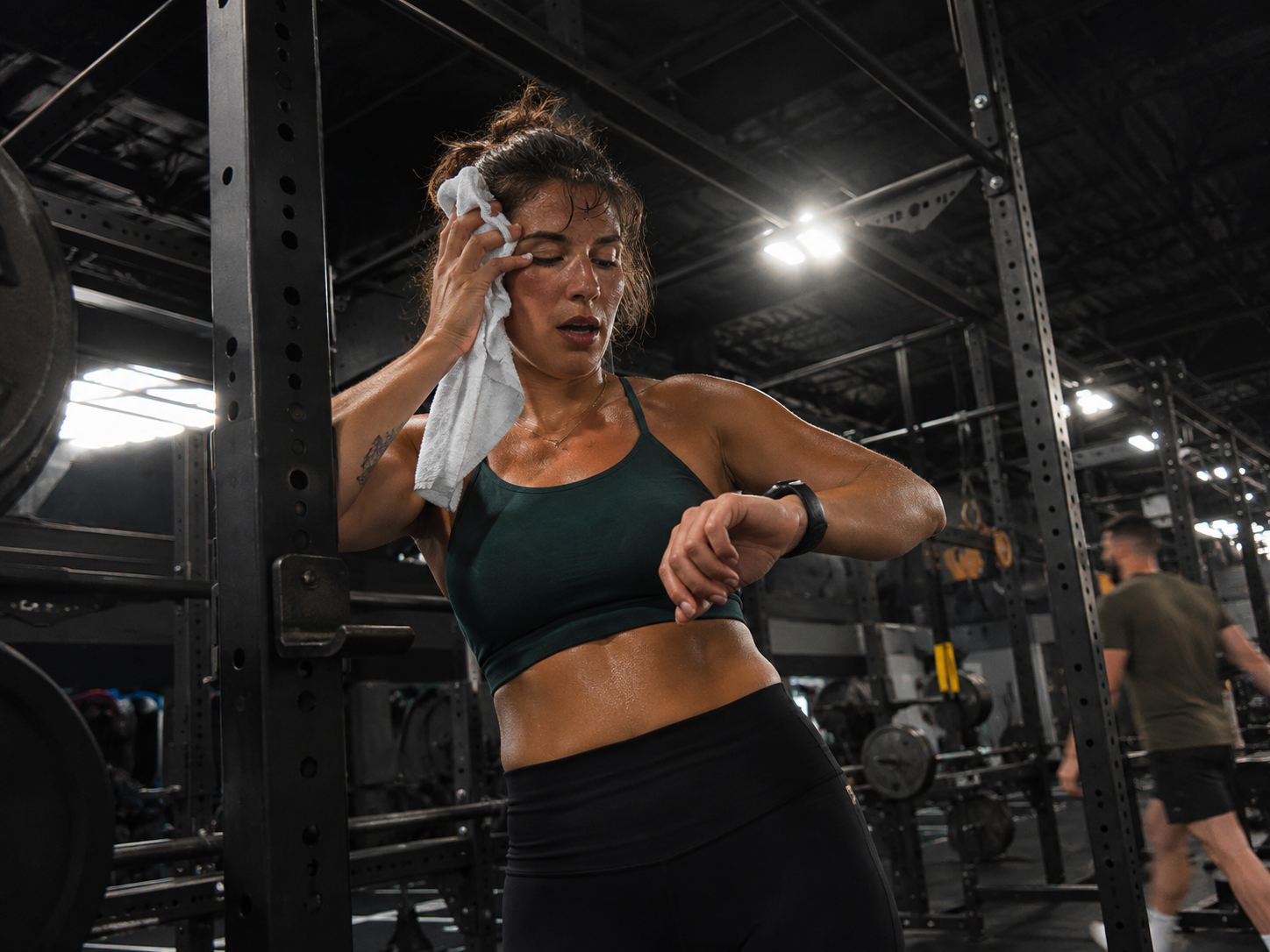 bmr and tdee to lose weight  -  checking a fitness watch after a gym session